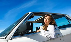 Woman Driving with Head Out of the Window