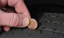 Cleaning tire treads with penny